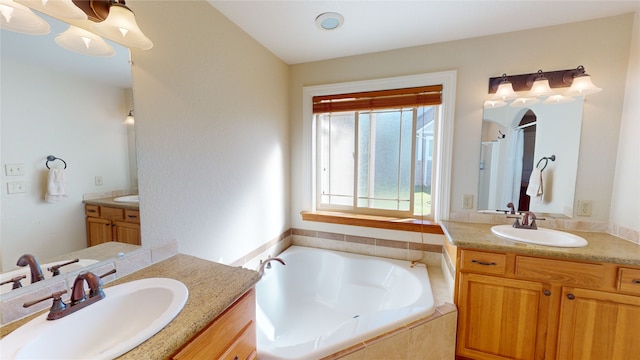 bathroom featuring independent shower and bath and vanity