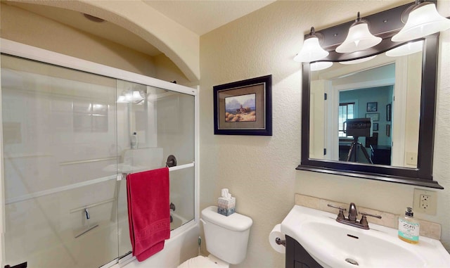 full bathroom with vanity, combined bath / shower with glass door, and toilet