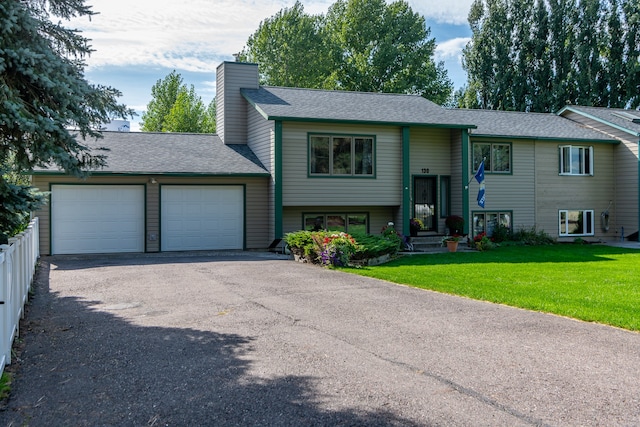 split foyer home with a front lawn and a garage