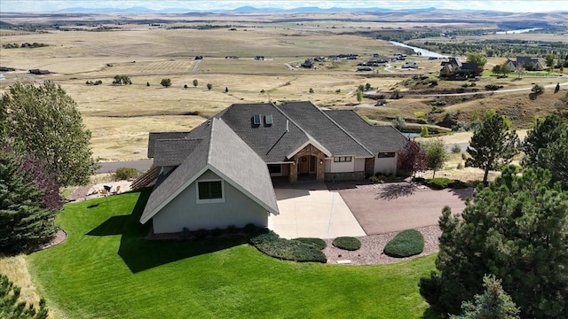 birds eye view of property with a mountain view