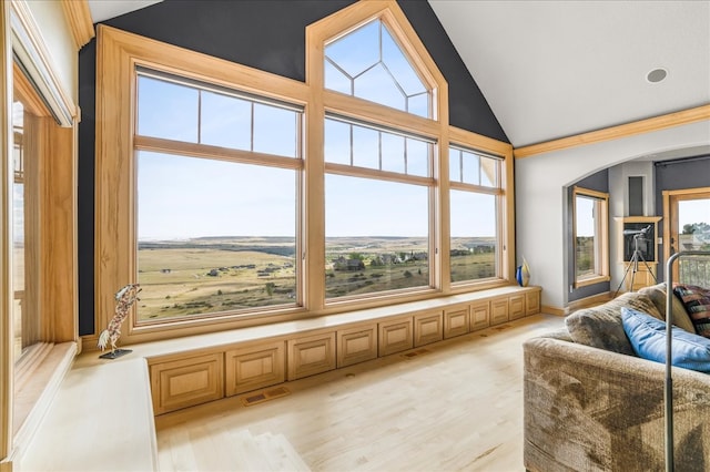 sunroom / solarium featuring lofted ceiling