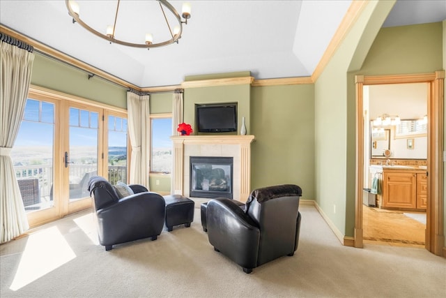 carpeted living room with lofted ceiling, an inviting chandelier, and crown molding