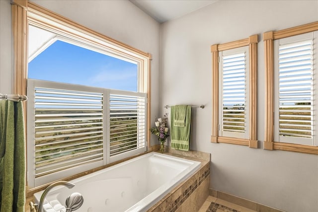 bathroom with a relaxing tiled tub