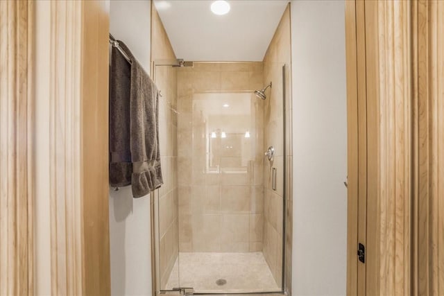bathroom with a shower stall