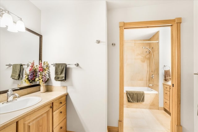 bathroom with vanity and tiled shower / bath combo