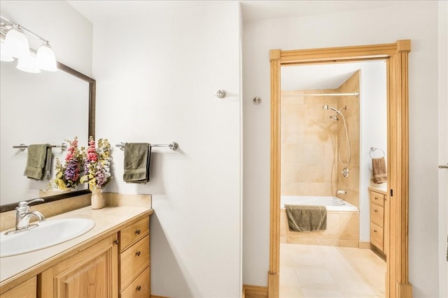 full bathroom with vanity and tiled shower / bath combo