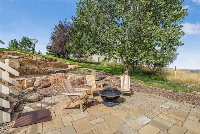 view of patio featuring a fire pit