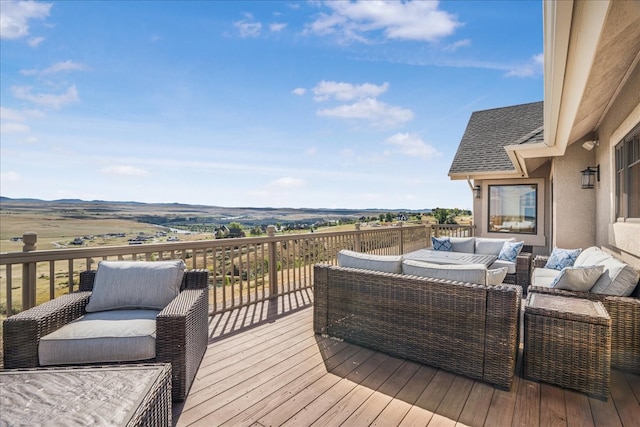 wooden terrace featuring outdoor lounge area