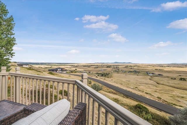 balcony featuring a rural view