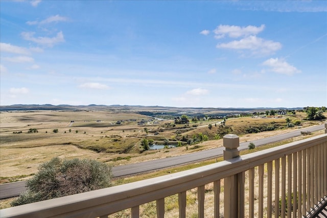 balcony featuring a rural view