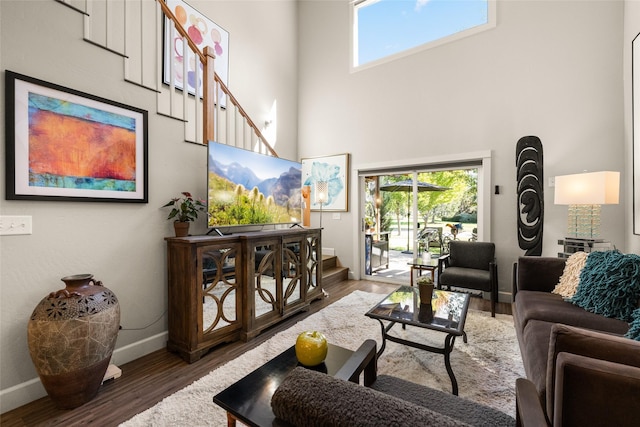 5200 Tumblehome Ave, Whitefish, MT 59937 - living area with a towering ceiling, wood finished floors, healthy amount of natural light, and stairs