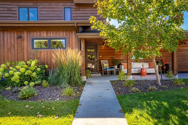 doorway to property featuring a patio area