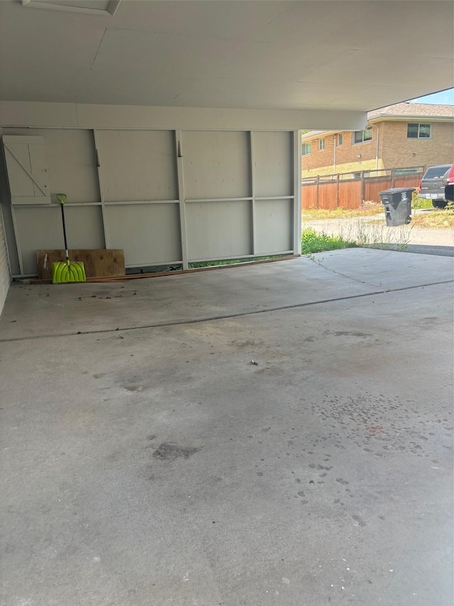 1147 W Steele St, Butte, MT 59701 - garage featuring a carport and fence