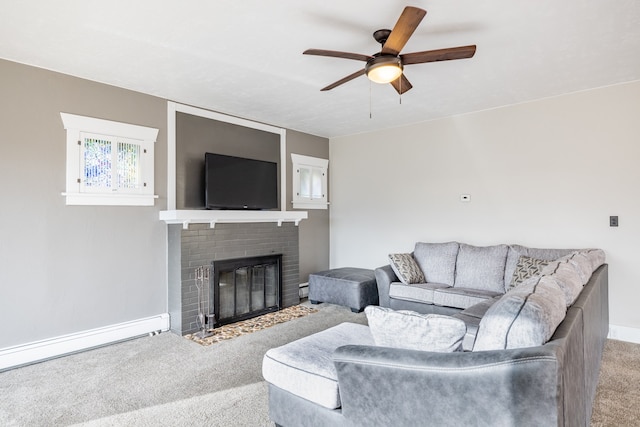 living room featuring a fireplace, carpet flooring, a baseboard heating unit, and ceiling fan