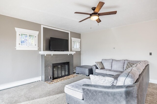 1147 W Steele St, Butte, MT 59701 - carpeted living room featuring ceiling fan, a baseboard heating unit, a brick fireplace, and baseboards