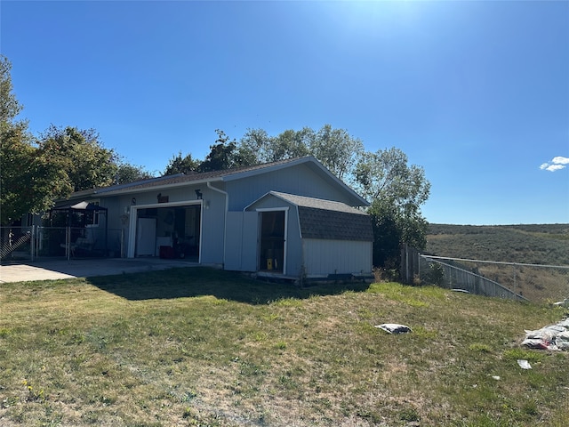 rear view of property with a lawn