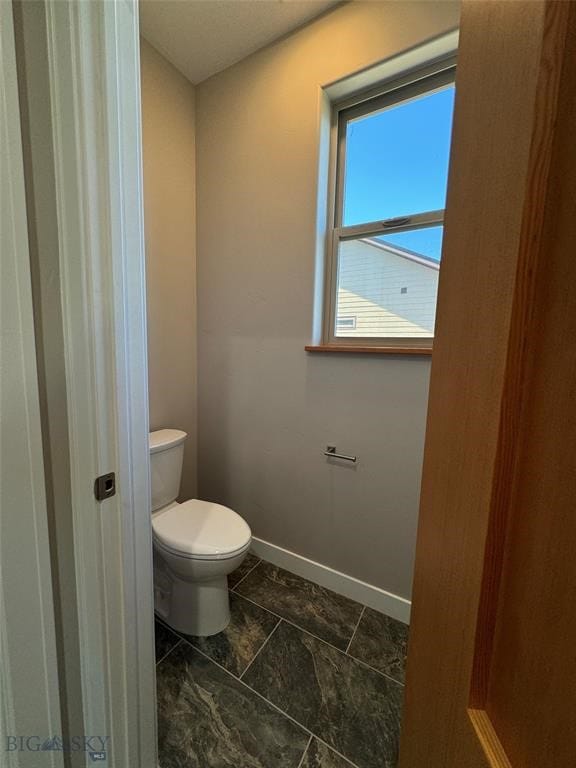 bathroom featuring toilet