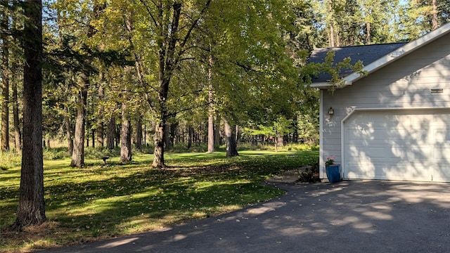 view of yard with a garage