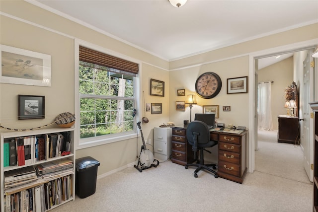 carpeted home office with ornamental molding and baseboards