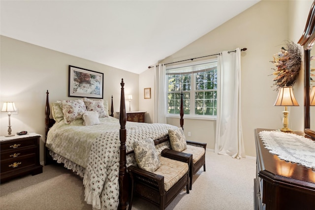 bedroom featuring vaulted ceiling, light carpet, and baseboards