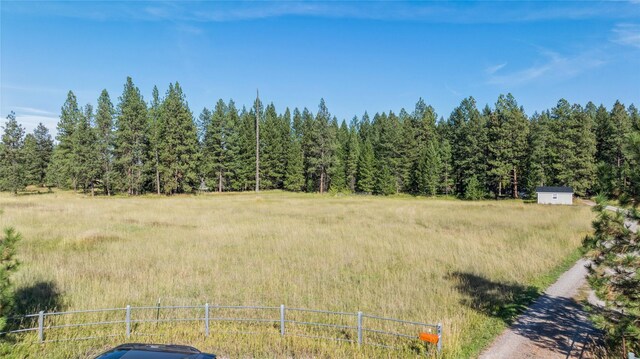 exterior space featuring a forest view