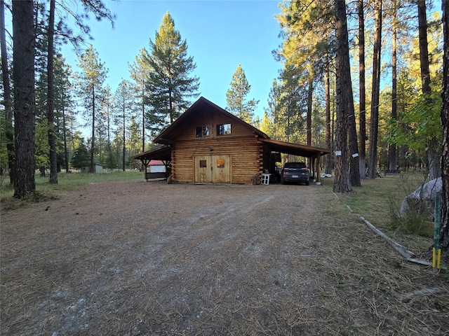 view of property exterior with a carport