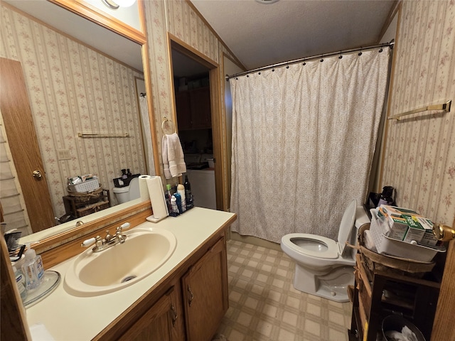 bathroom featuring a shower with shower curtain, a textured ceiling, vanity, and toilet