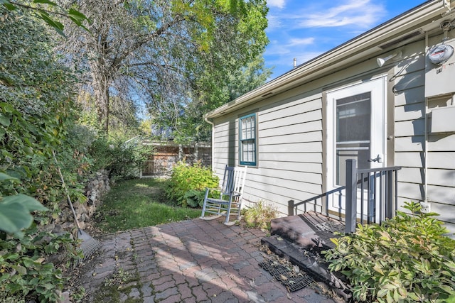 view of patio featuring fence
