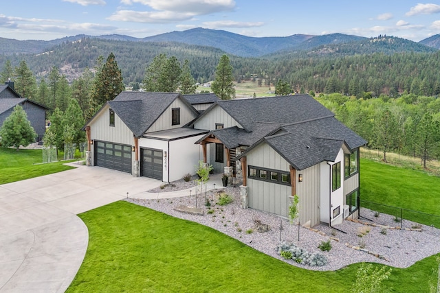 modern farmhouse with a mountain view and a front yard