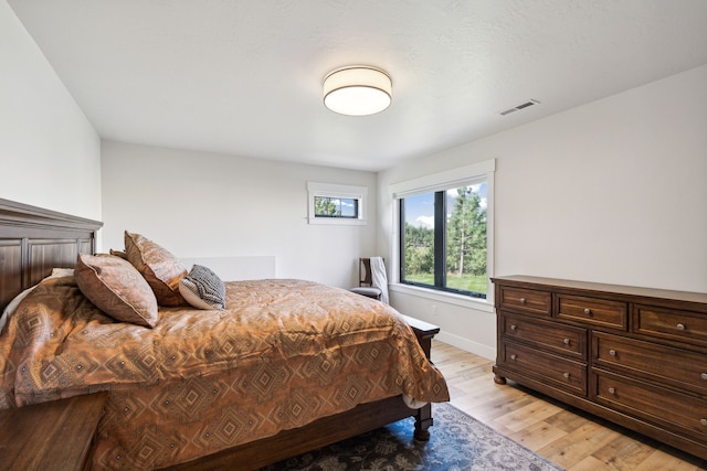 bedroom with light hardwood / wood-style floors