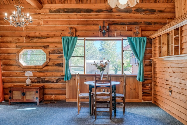2237 Grave Creek Rd, Eureka, MT 59917 - carpeted dining room with healthy amount of natural light, log walls, a chandelier, and wooden ceiling