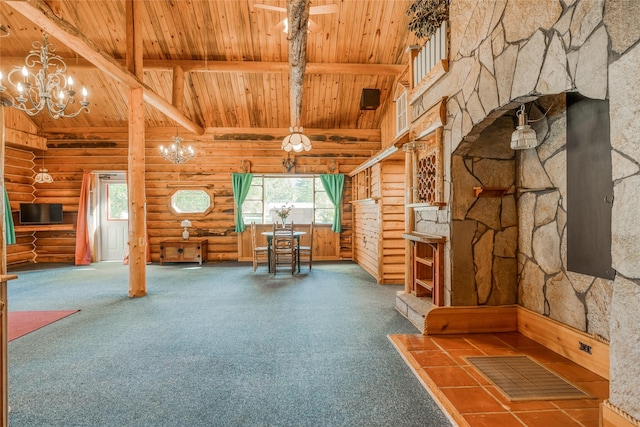 2237 Grave Creek Rd, Eureka, MT 59917 - unfurnished living room with a wood ceiling with exposed beams, a chandelier, rustic walls, carpet floors, and high vaulted ceiling