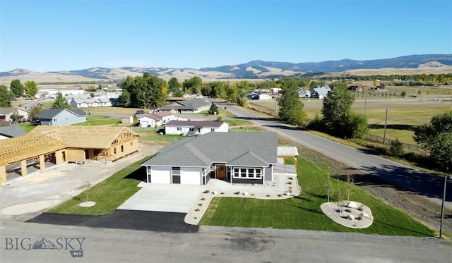 drone / aerial view featuring a mountain view