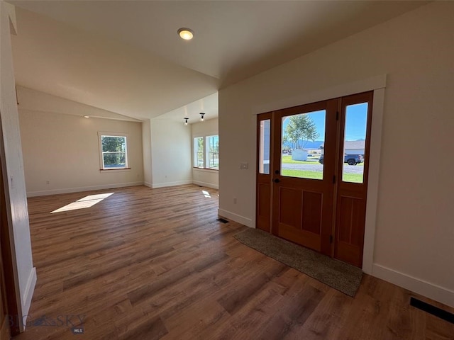 entryway featuring vaulted ceiling and hardwood / wood-style floors