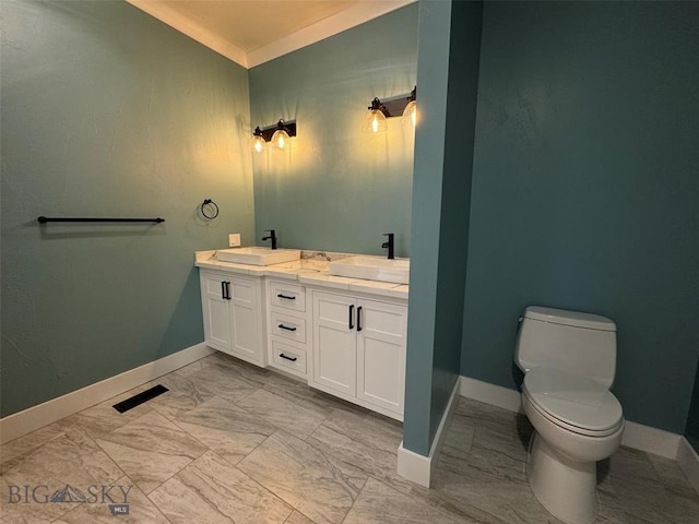 bathroom featuring vanity and toilet