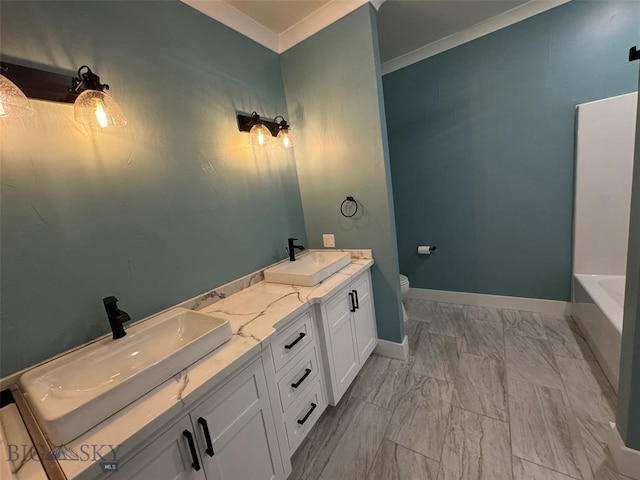 bathroom featuring vanity, a tub to relax in, crown molding, and toilet