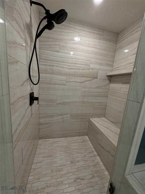 bathroom featuring tiled shower