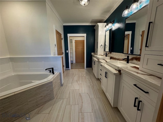 bathroom with ornamental molding, vanity, and a relaxing tiled tub