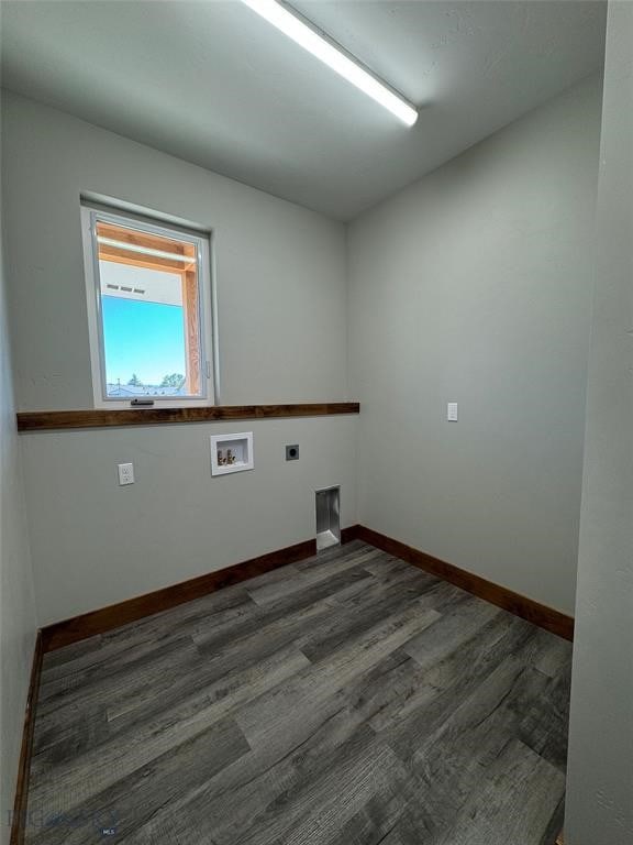 spare room with dark wood-type flooring