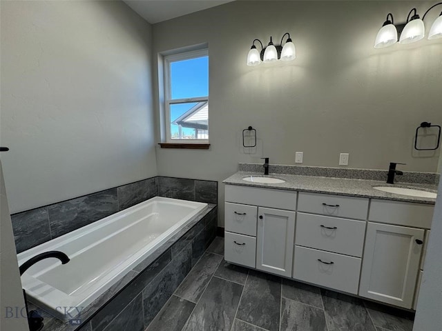 bathroom featuring vanity and tiled bath