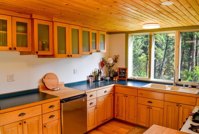 kitchen with fridge, light wood-type flooring, and wooden ceiling