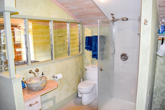 bathroom with lofted ceiling, wooden ceiling, toilet, and a tile shower