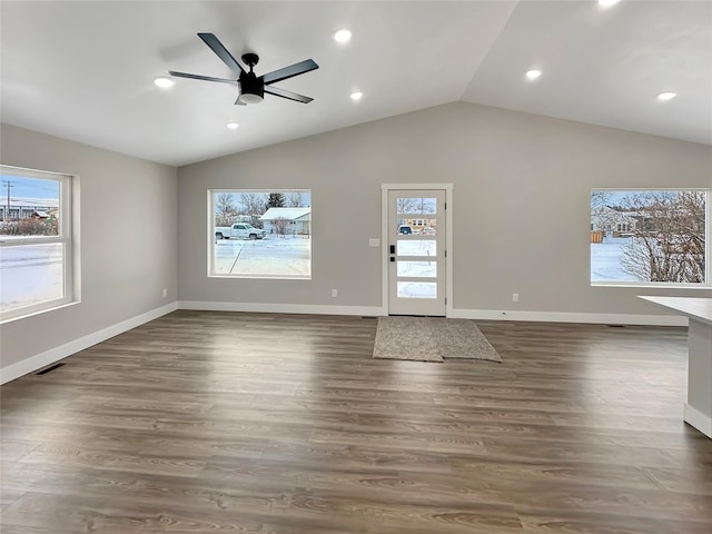 interior space featuring lofted ceiling, dark wood-type flooring, and ceiling fan