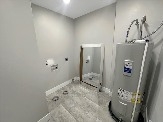 clothes washing area with washer hookup, water heater, and hookup for an electric dryer