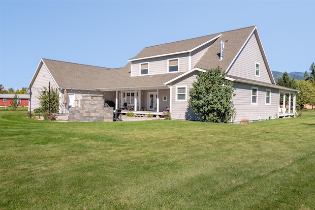 back of house featuring a yard