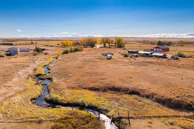 aerial view featuring a rural view and a mountain view