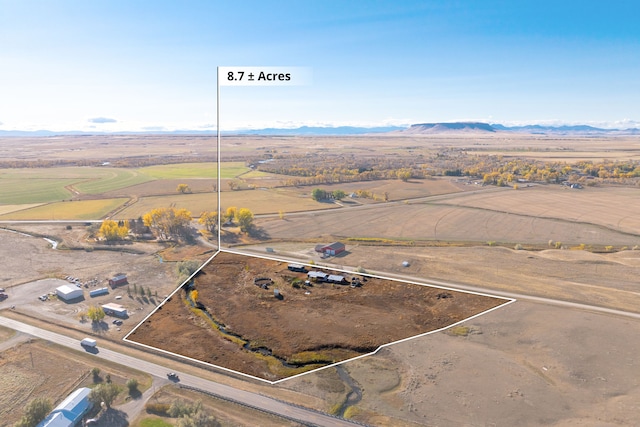 aerial view featuring a mountain view and a rural view