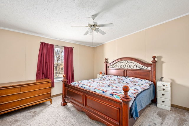 carpeted bedroom with ceiling fan, ornamental molding, and a textured ceiling