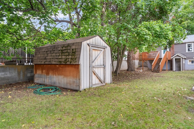 view of outdoor structure featuring a lawn