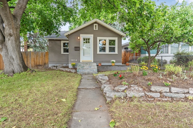 bungalow with a front lawn